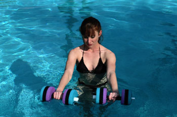 Lady with Foam Dumbbells in Pool